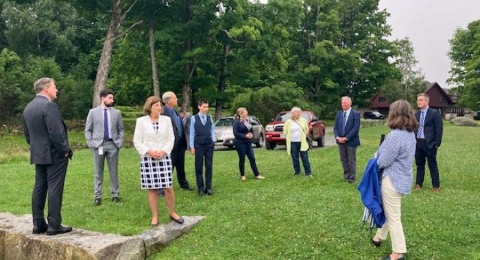 Executive Councilors and Governor Sununu stand on the grounds of The Rocks.