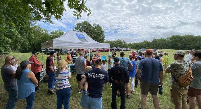 attendees at Forest Society tent at Dottie Bean Forest