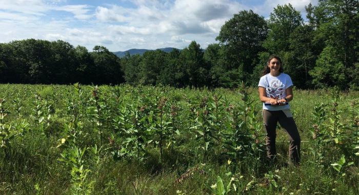 Researcher Katie Galletta standing in High Five fields.