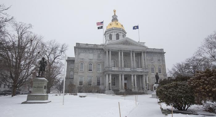 NH State Capital Building on gray snowy day