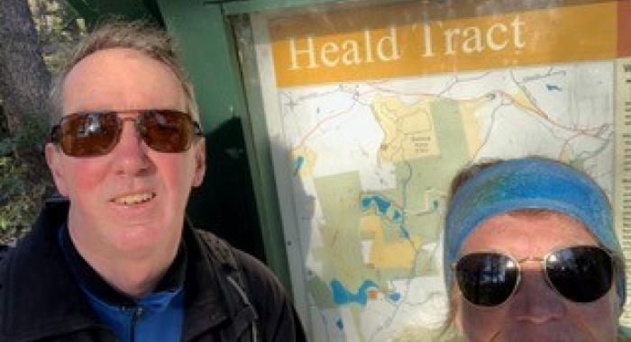 David and Lynne Bishop pose in front of the kiosk at Heald Tract.