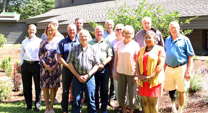 The board poses in front of the Conservation Center.