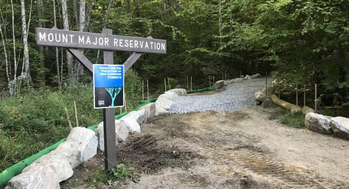 A sign for Mt. Major is surrounded by rocks and dirt during construction.