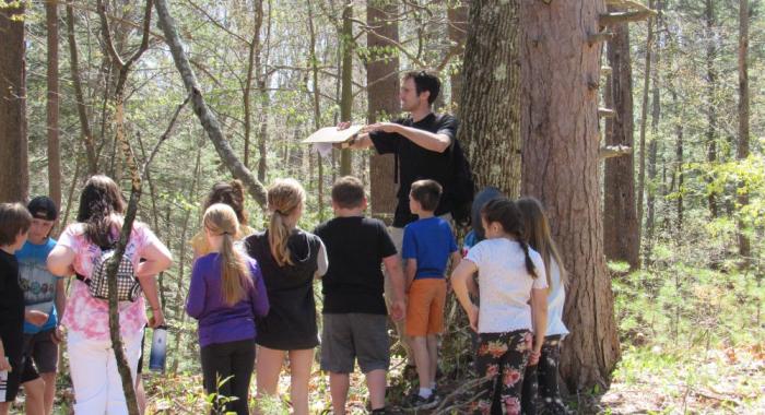 Students listening to forester