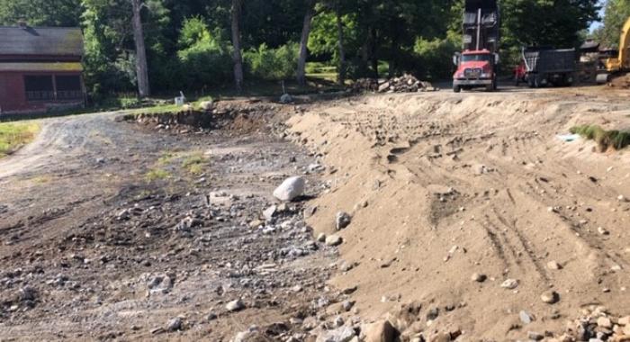 Construction equipment works on moving dirt at the site of the historic Tool Building at The Rocks.