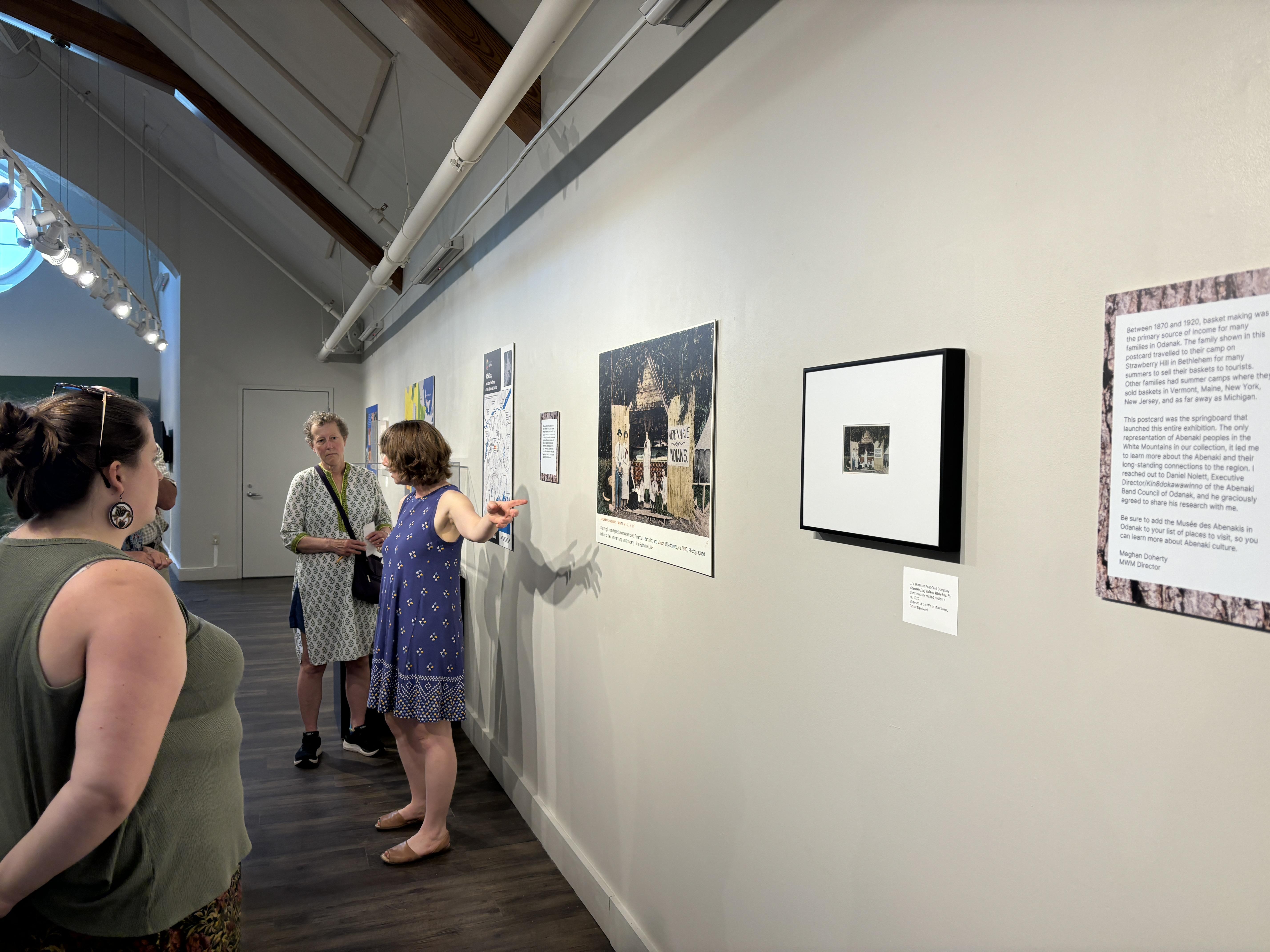 Museum of the White Mountains Director Meghan C. Doherty explained the exhibit to the group.