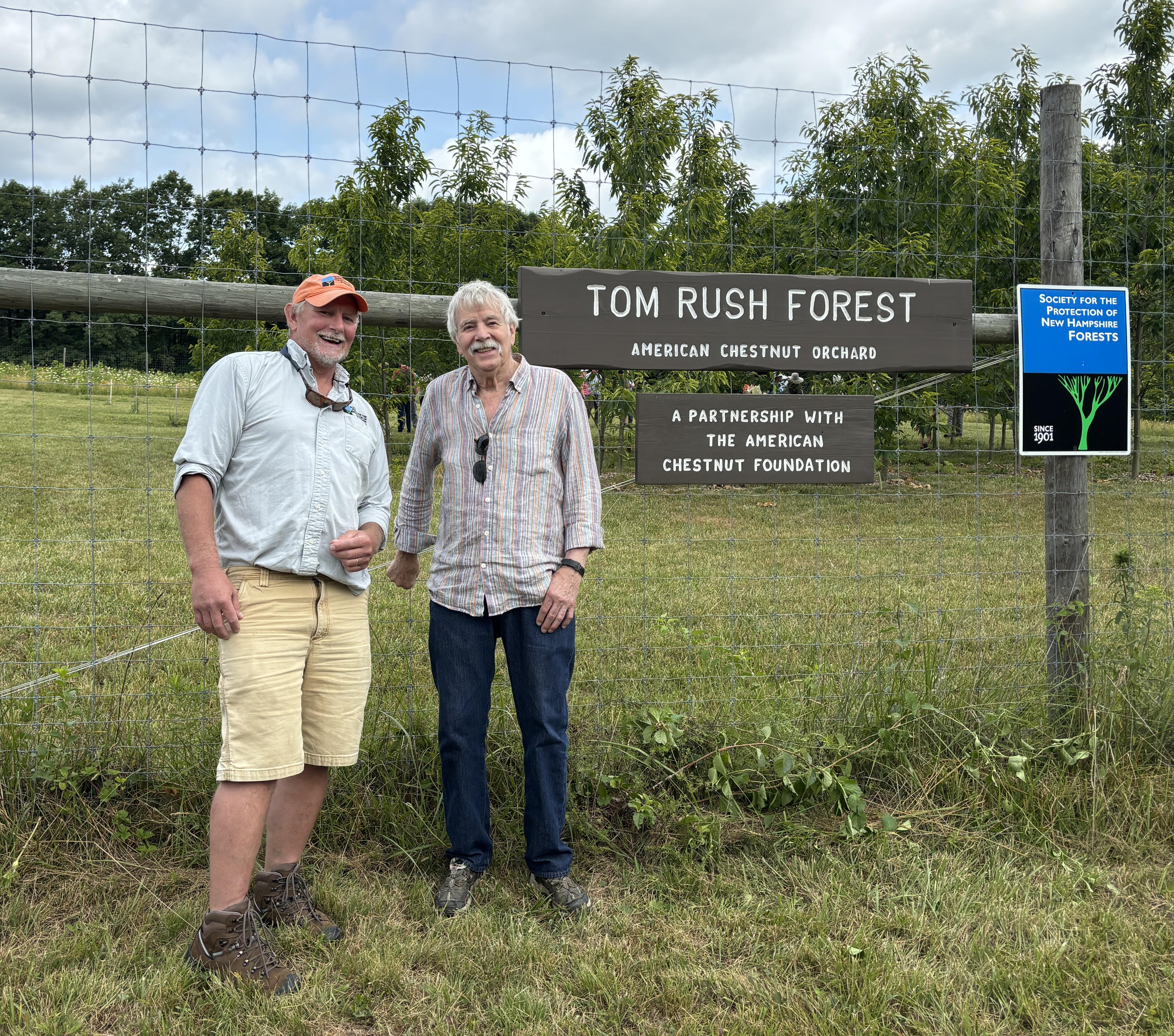Dave Anderson and Tom Rush pose in front of the Tom Rush Forest.