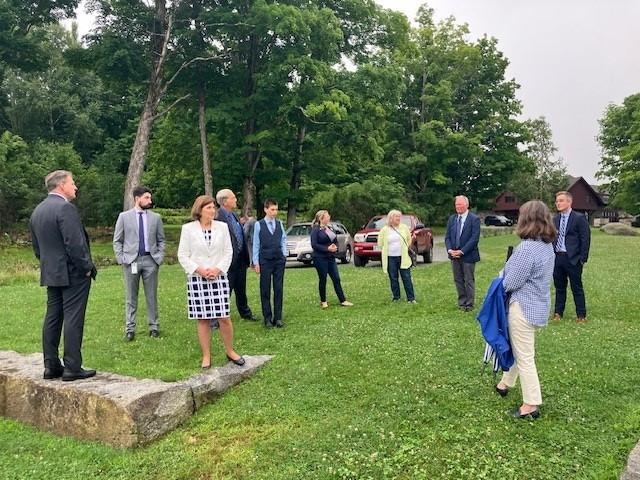 Executive Councilors and Governor Sununu stand on the grounds of The Rocks.