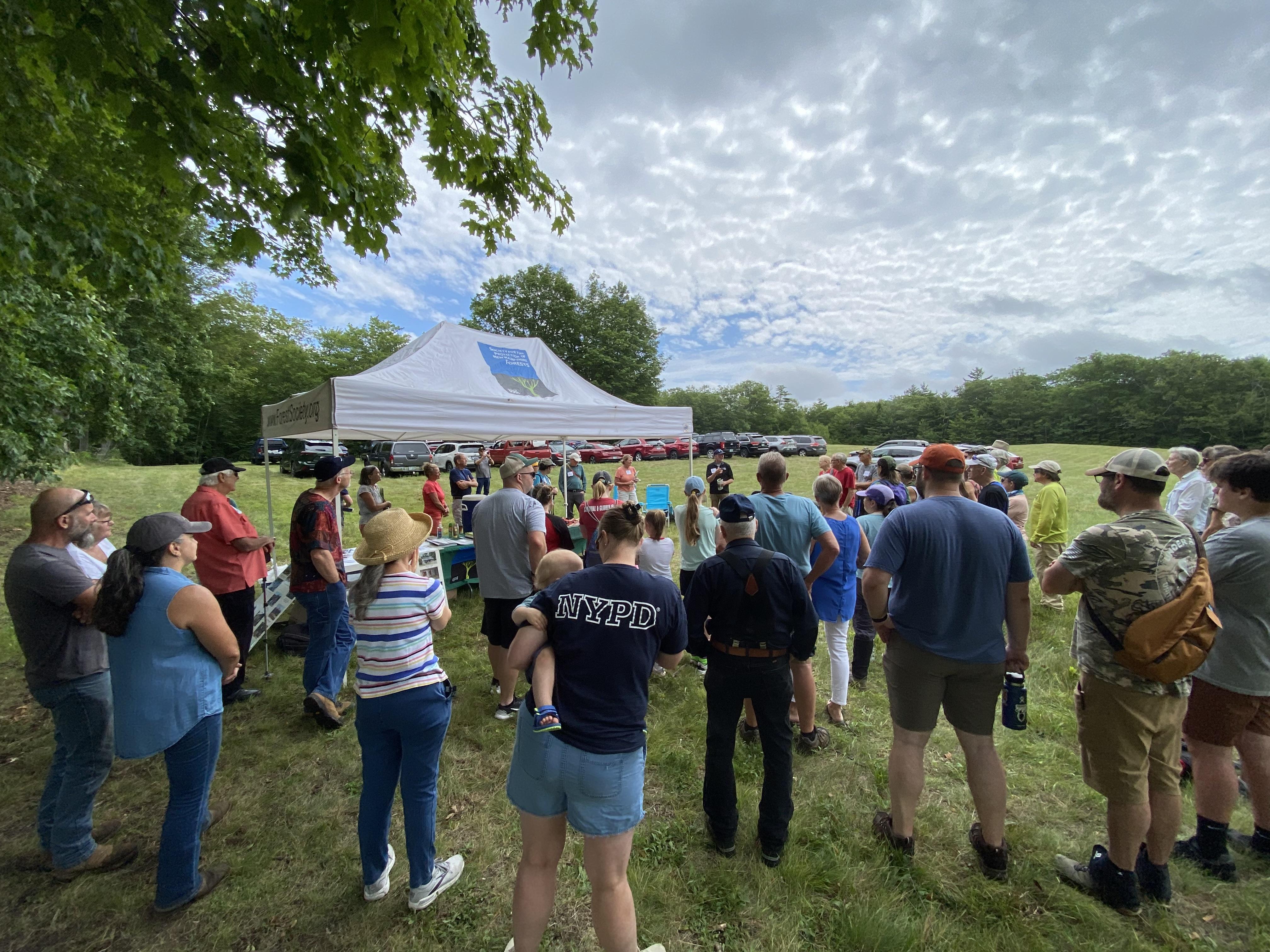 attendees at Forest Society tent at Dottie Bean Forest