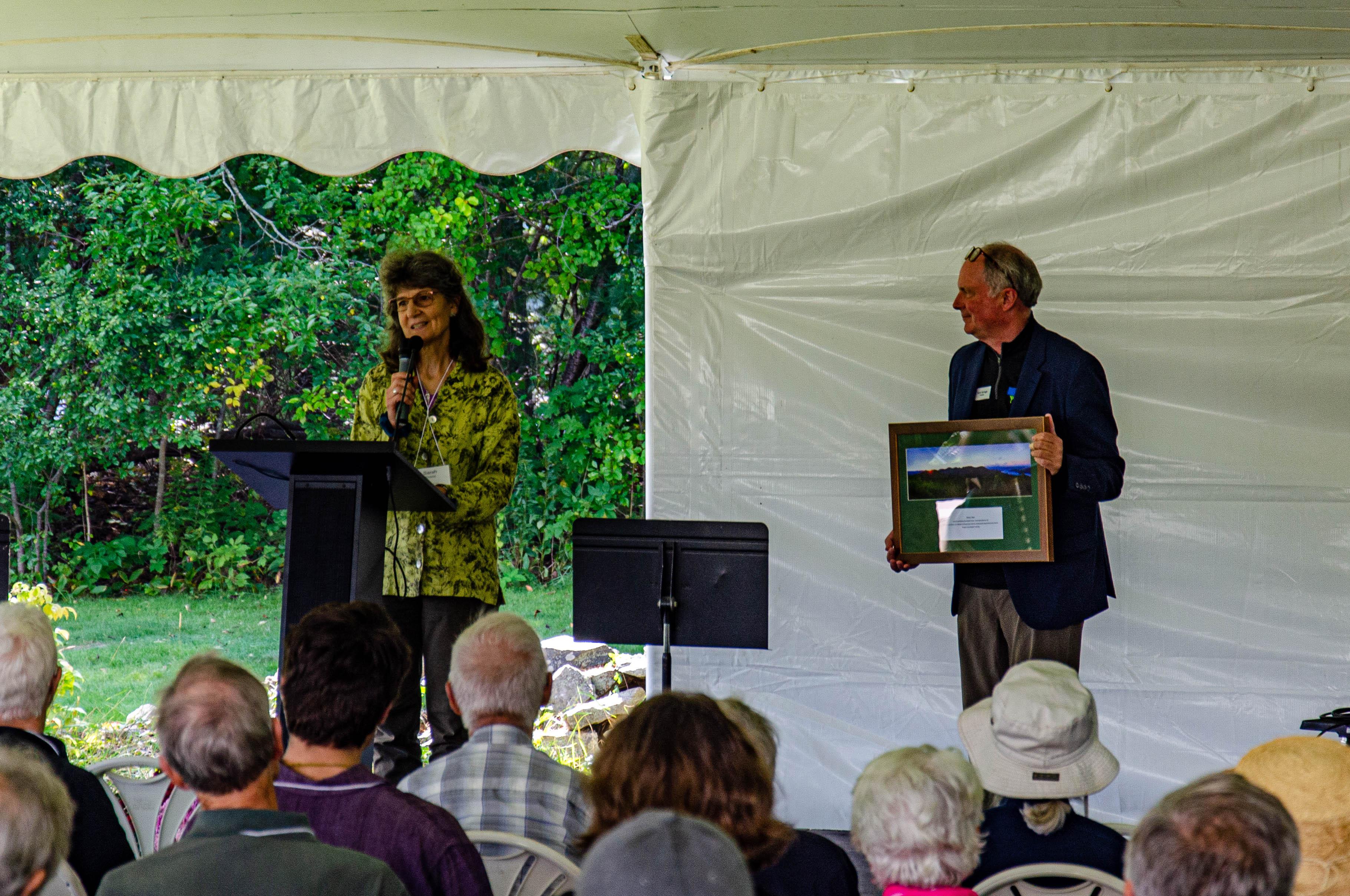 Sarah Thorne, wife of the late Tom Howe, accepted the award from President Jack Savage on stage at the annual meeting.