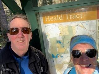 David and Lynne Bishop pose in front of the kiosk at Heald Tract.