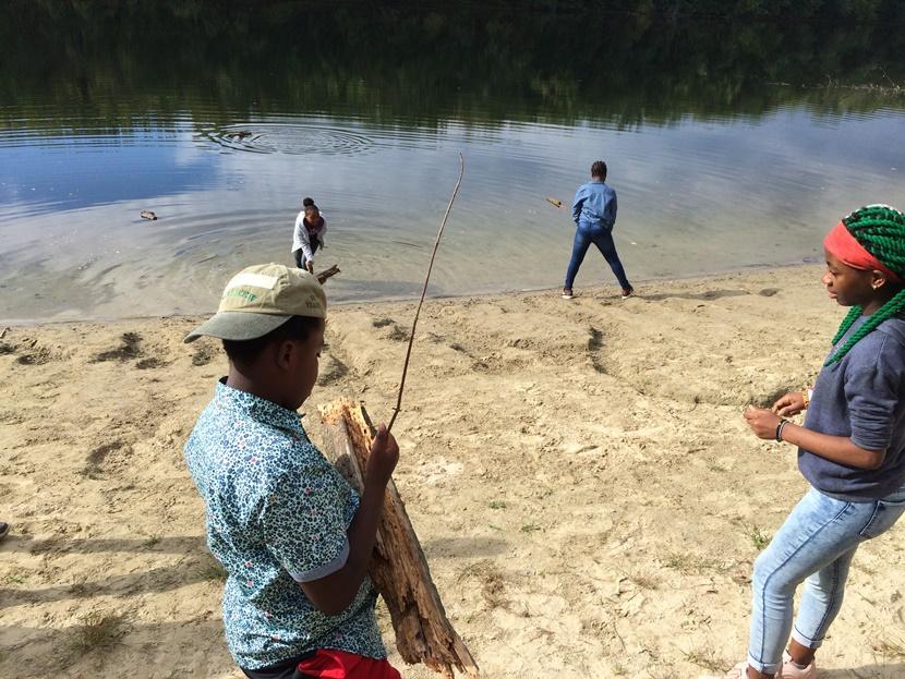 Building boats on the river bank.