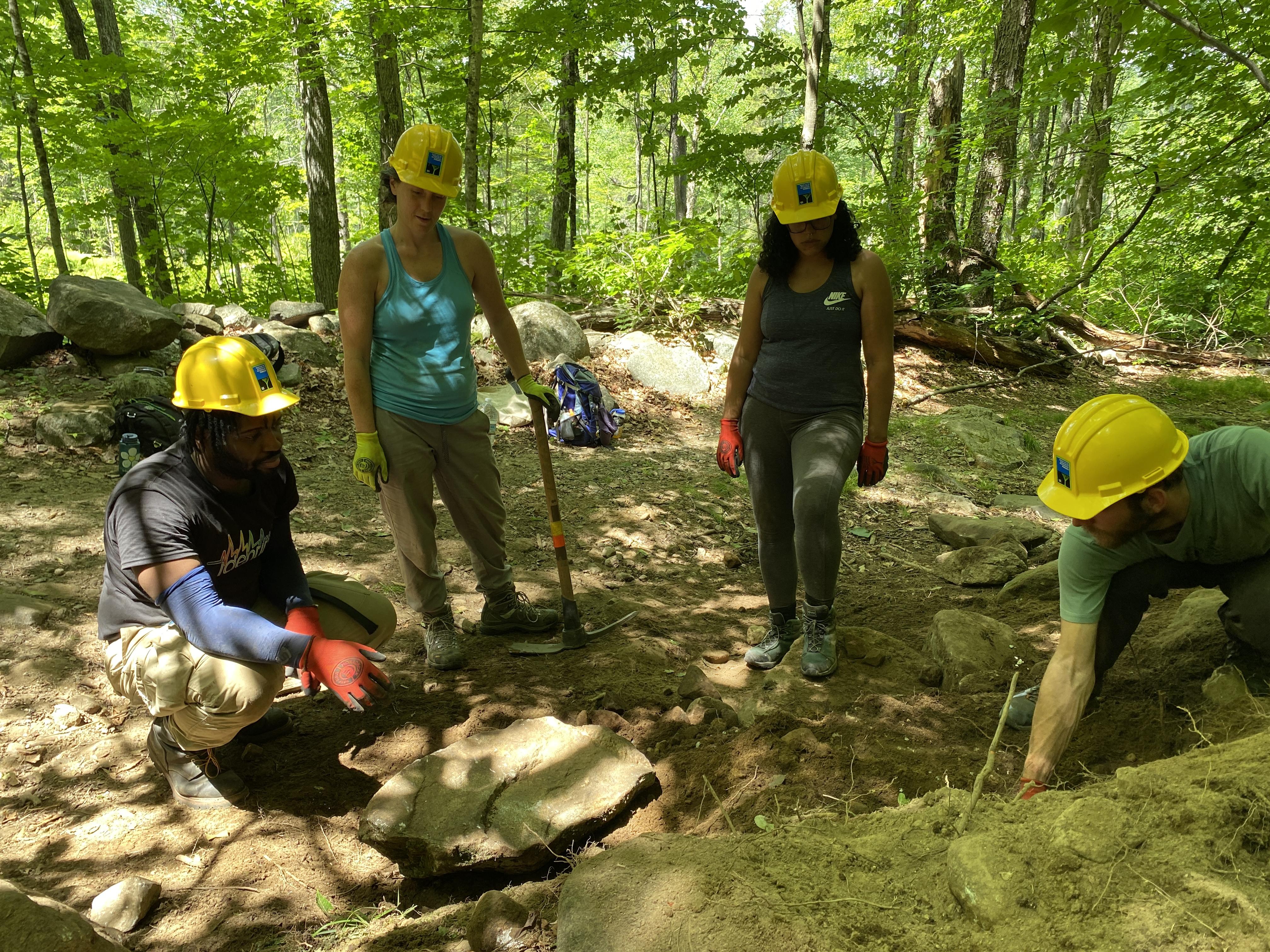 Volunteers point to an area needing improvement on Gap Mountain.