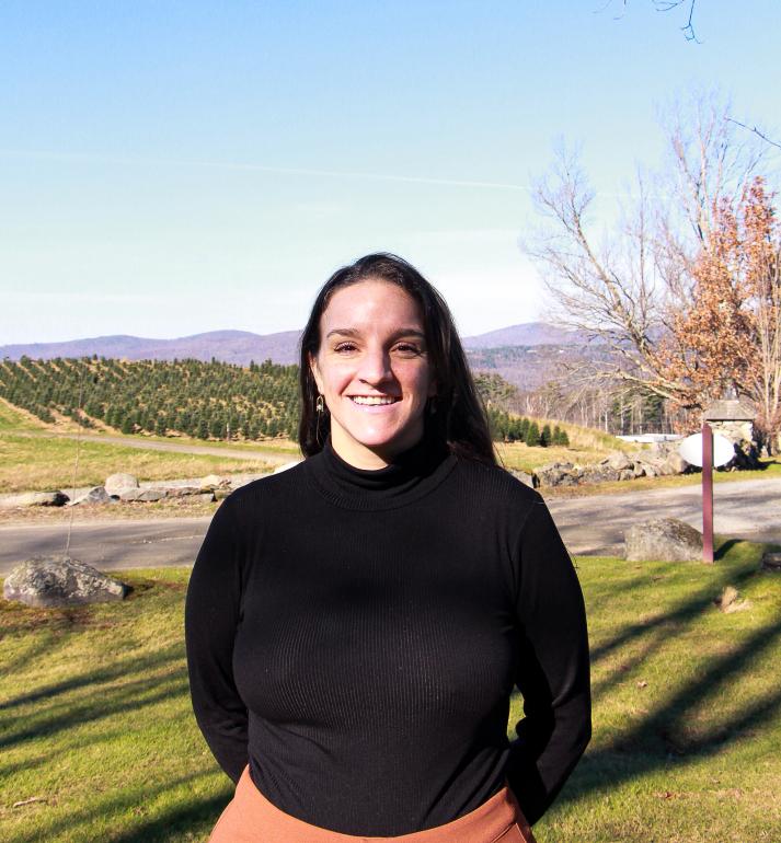 Scarlett Moberly poses outside near the Christmas tree fields.