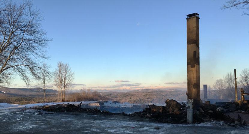 Only the chimney is left standing after a fire at the Rocks in Bethlehem New Hampshire