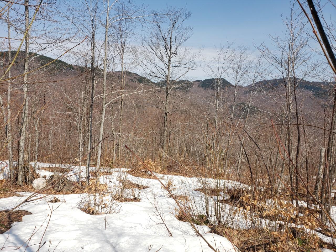 snowy field overlooking mountains