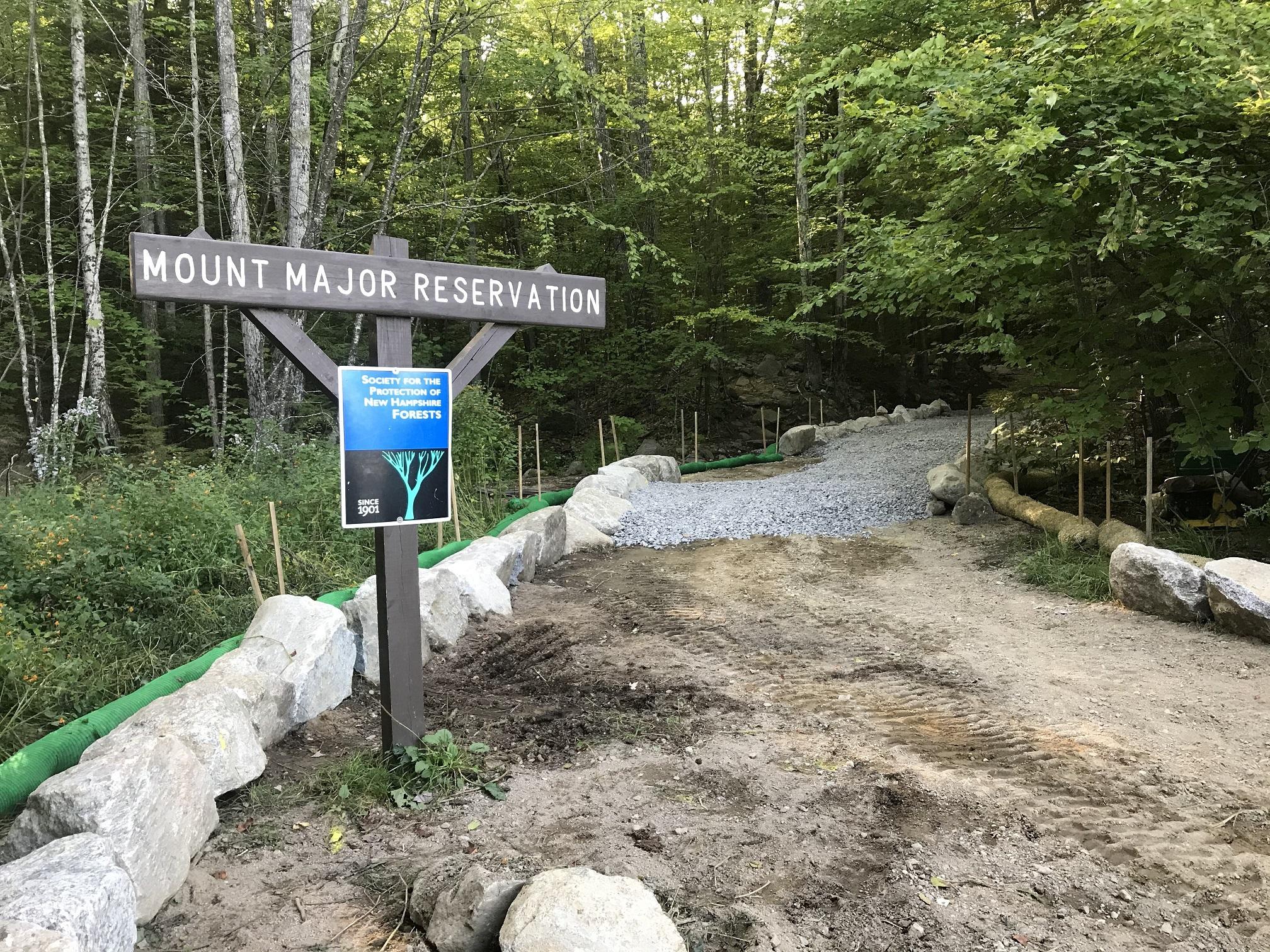 A sign for Mt. Major is surrounded by rocks and dirt during construction.