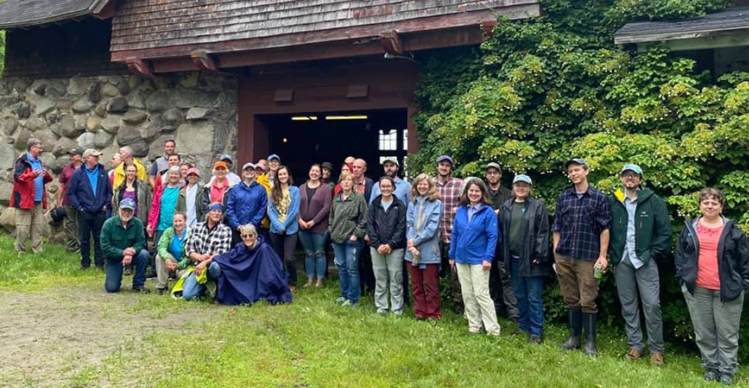 Staff and board pose in front of the Carriage Barn at The Rocks.