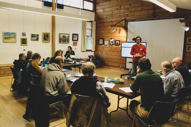 staff training volunteers around conference table