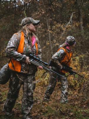 Women hunters in camoflage and blaze orange vests