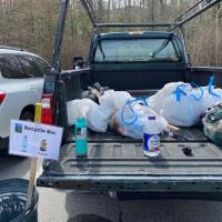 A Forest Society truck is partially full of bags of trash collected on Mount Major.