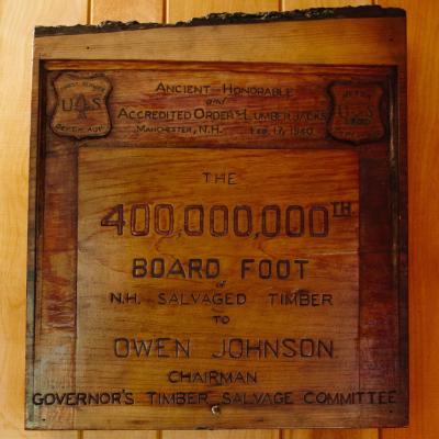 The 400,000,000th board foot of NH timber salvaged from the Hurricane of 1938 is on display in the Philip Ayers Room honoring Forest Society’s first President/Forester at the Conservation Center in Concord.