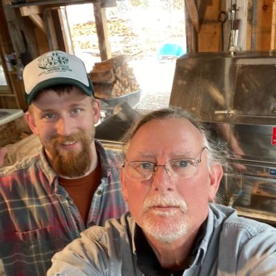 Dave Anderson takes a selfie with his son in the sugarhouse at his farm.