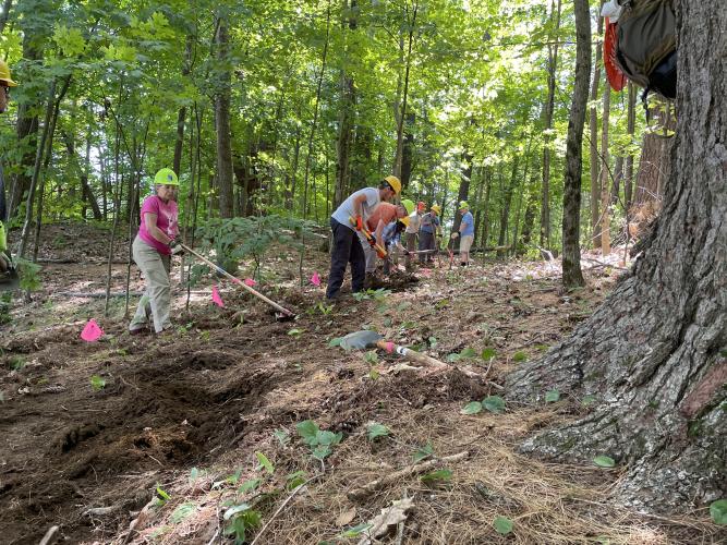 Volunteers help build the new trail.