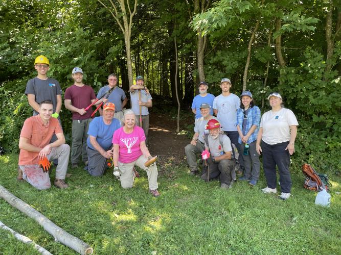 Volunteers and staff pose at Gipson Forest.