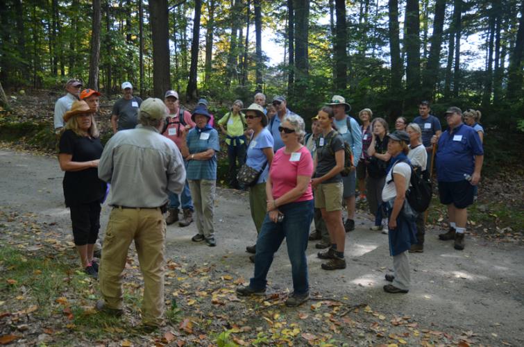 Visitors learn about working forests at a Muster Field Farm guided tour