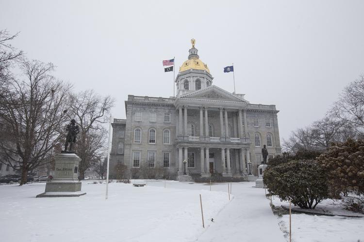 NH State Capital Building on gray snowy day