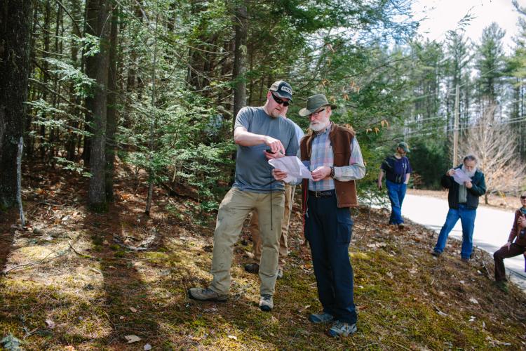 Outdoor conservation volunteers navigate property boundaries