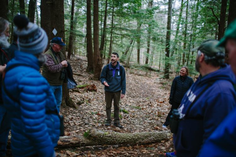 Program Coordinator Andy Crowley gives advice on clearing debris from a hiking trail