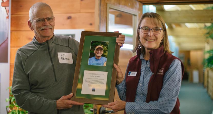 Lee Baker is awarded Volunteer of the Year by Forest Society president/forester Jane Difley