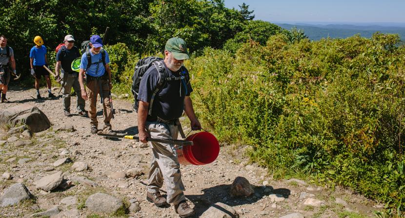 Volunteers hike tools and gear up Mount Monadnock for trail stewardship projects with the Forest Society and NH State Parks