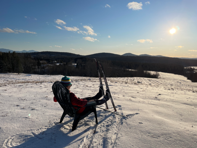 Leah Hart pauses to look at the mountain views on her skiis.